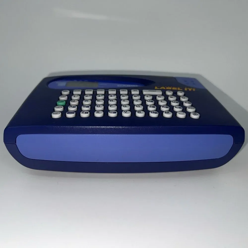 Casio LABEL IT! EZ-Label Printer Model # KL-60-L A Clear Tape Included Inside De